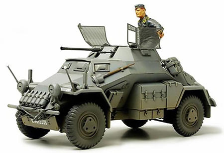  Tamiya Model of a German military vehicle with a figure on top against a white background