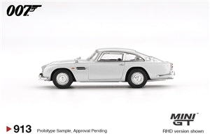 A side-profile view of a silver Aston Martin DB5 model car on a white background, with the 007 logo at top left and Mini GT / RHD version shown at bottom right.