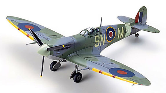 Model of a Supermarine Spitfire airplane with camouflage paint and visible markings on a white background