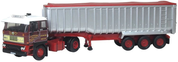 Model tipper truck with a large trailer on a white background