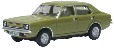 Diecast Model of a green Morris car on a white background