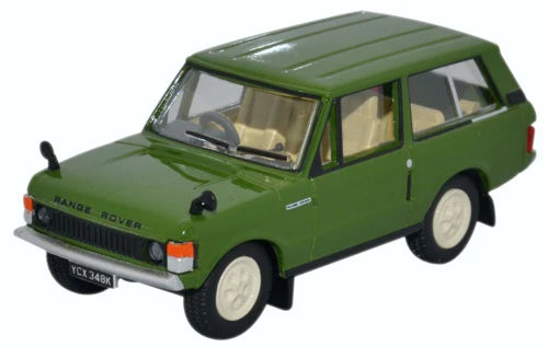 A green diecast model of a classic Range Rover , shown from a three-quarter front angle against a plain white background.