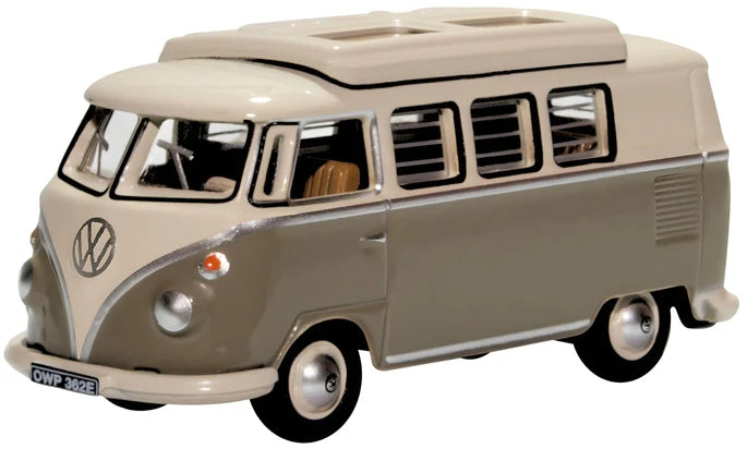 A diecast model of a classic Volkswagen Type I bus in a two-tone beige and gray color scheme, shown on a plain white background.