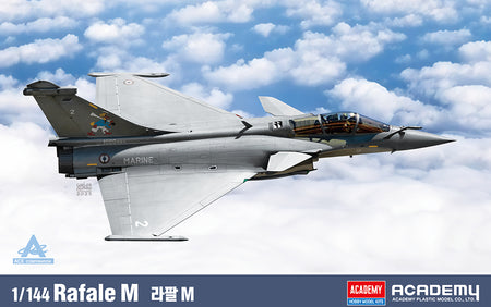 A 1/144 scale model kit packaging image for the Academy Rafale M fighter jet. The product is shown as a grey military aircraft with military insignia, flying against a blue sky with white clouds.