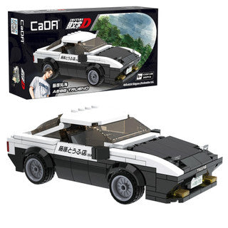 Brick build model of a police vehicle with 'CaDA' branding, displayed in front of its packaging.