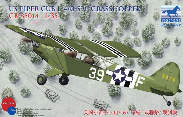 Model airplane of US Piper Cub L-410-59F Grasshopper with branding on a snowy landscape.