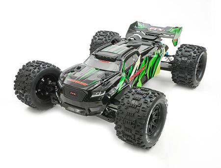 Black and green remote control monster truck on a white background
