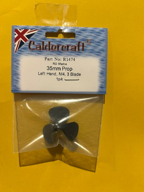 3 blade black plastic boat propeller on a yellow background