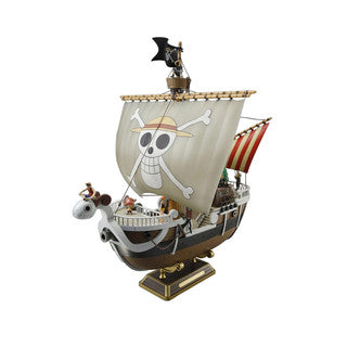 Model of a colourful whimsical anime pirate ship in full sail on a square dispaly base.