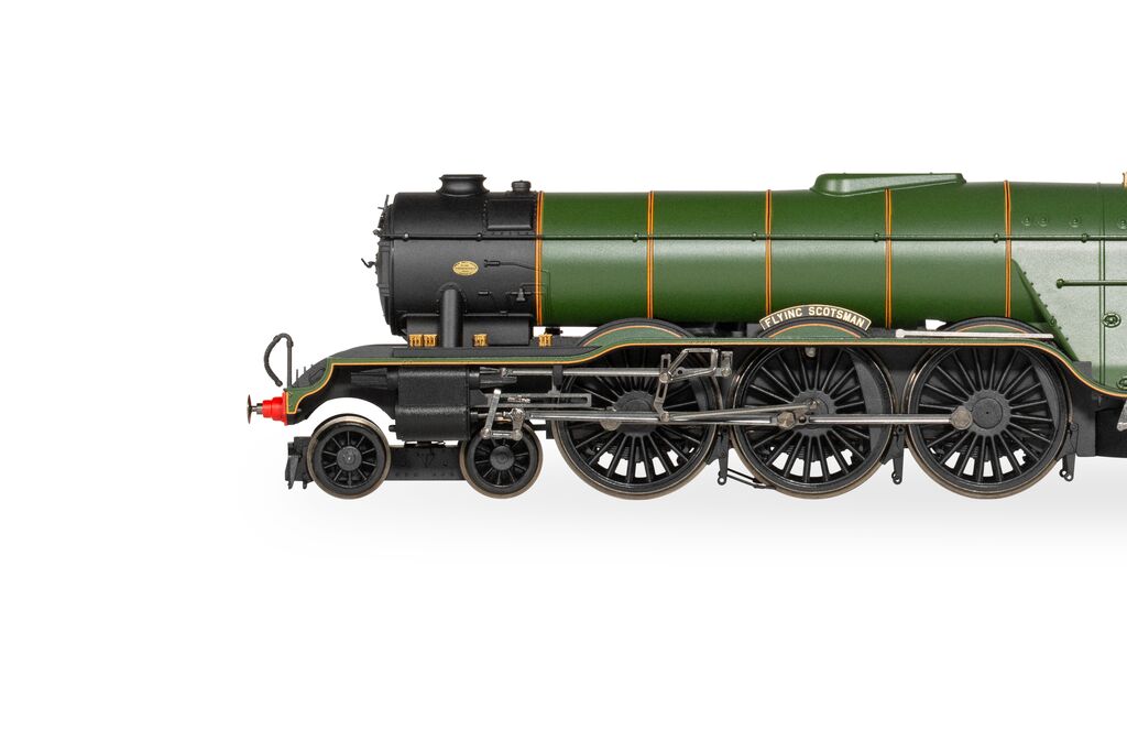 Model of a green steam locomotive on a white background