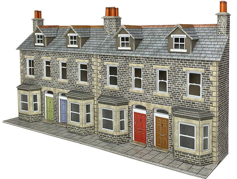 Model of a three-story brick building with different colored doors on a white background