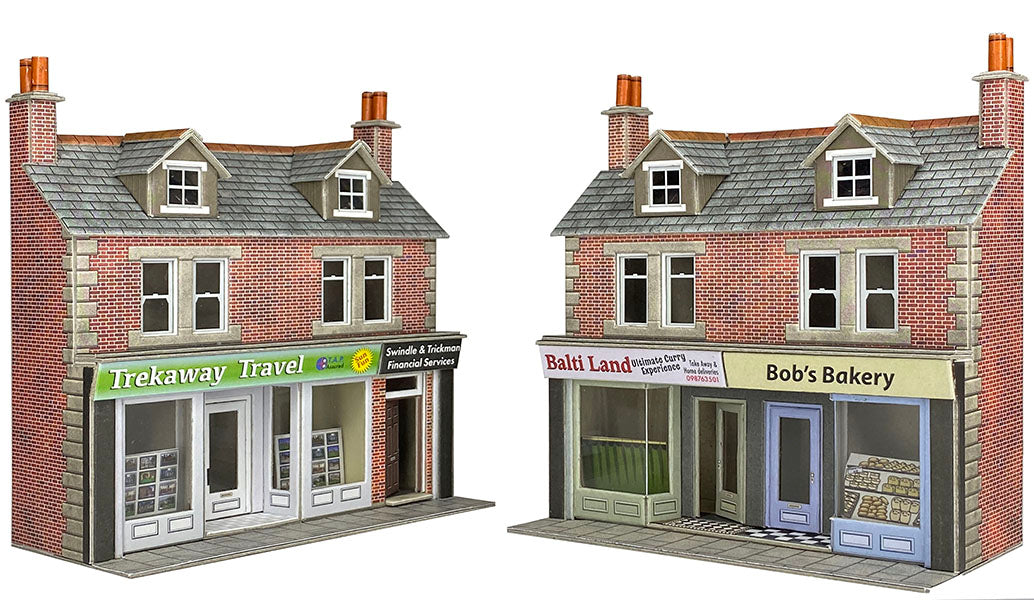 Model townhouses with businesses labeled 'Trekaway Travel' and 'Bob's Bakery' on a white background.