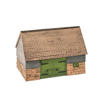 Model of a rustic building with a green door and stone walls on a white background