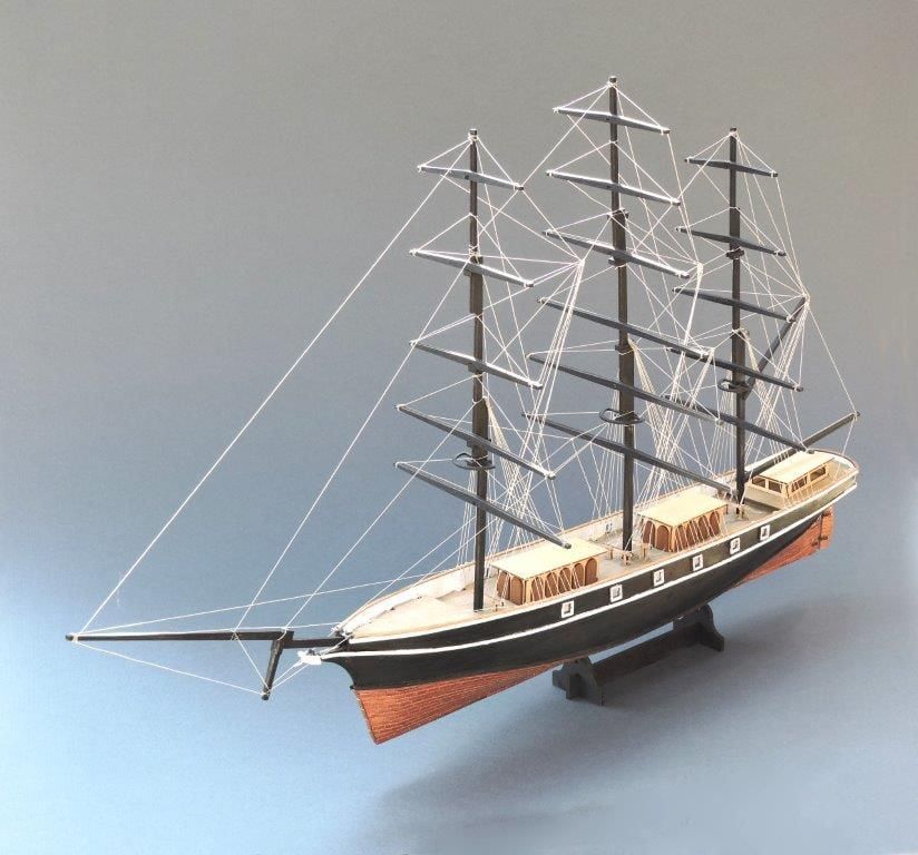 Model of the three-masted sailing ship  Cutty Sark on a grey background