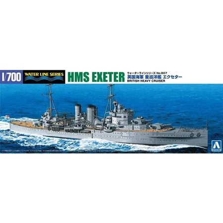 A 1/700 scale model kit box for HMS Exeter, a British heavy cruiser from the Water Line Series. The packaging features a detailed illustration of the gray ship sailing on blue ocean waves, with text in English, Japanese, and German, and the A scale logo in the bottom right corner.