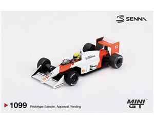 A 1/64 scale model of a Senna F1 car, featuring white, orange, and black livery with sponsor decals, shown on a light grey background with Senna and Mini GT branding.