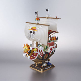 Model of a colourful whimsical anime pirate ship in full sail on a square dispaly base.