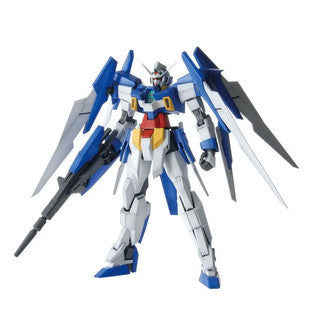 A blue and white Gundam action figure with yellow and red accents, holding a long gun, set against a plain white background.