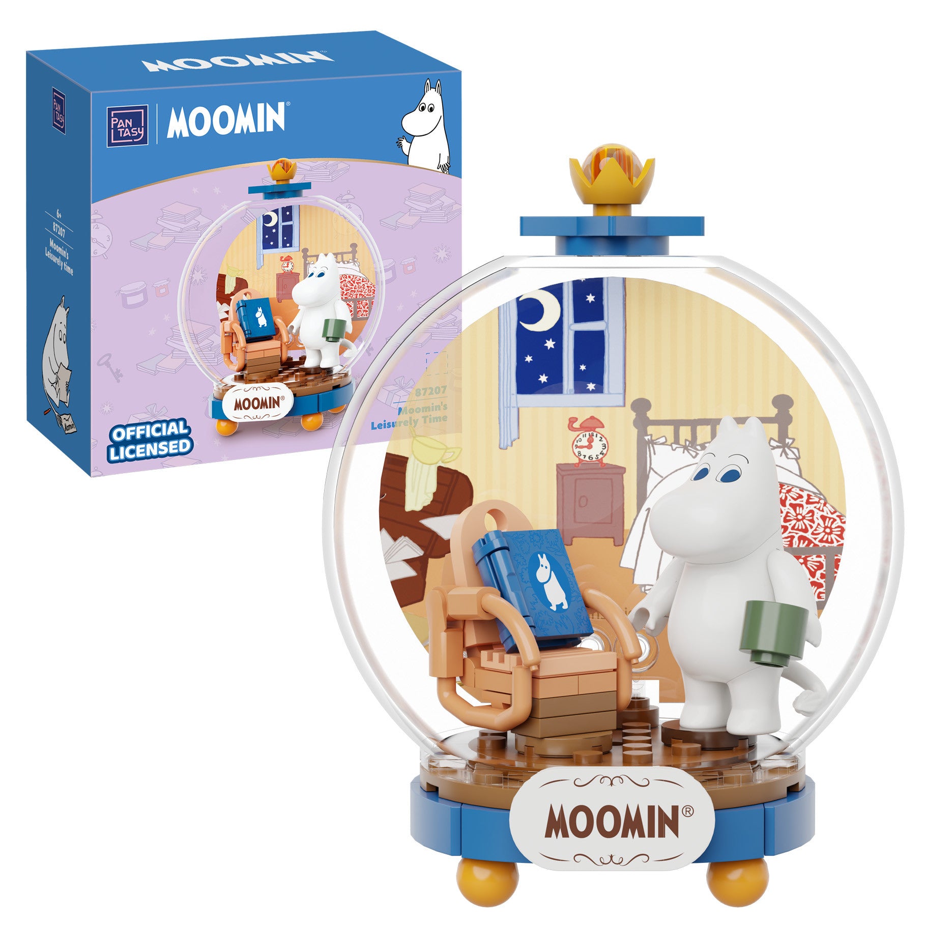Official licensed Moomin building block set featuring a white Moomin figure inside a clear round display dome with a cozy bedroom scene, shown alongside its purple retail box on a white background.