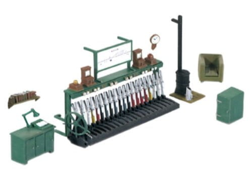 Model railway signal box interior equipment set on a white background